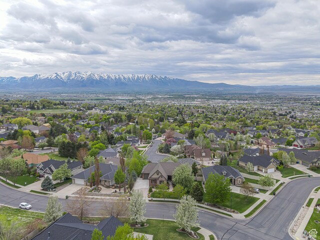birds eye view of property with a residential view and a mountain view