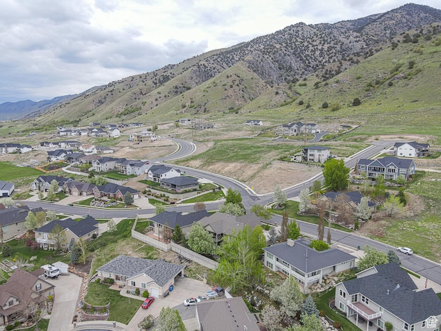 drone / aerial view featuring a residential view and a mountain view