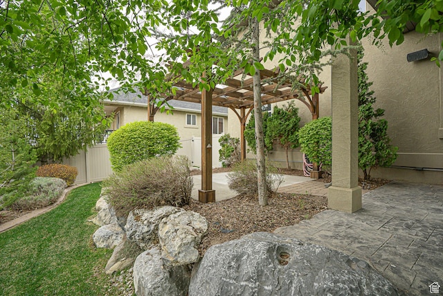 view of yard with a pergola, a patio area, and a fenced backyard