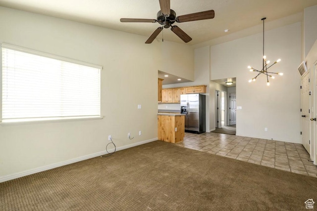 474 S 2550 W Unit 2, Springville, UT 84663 - unfurnished living room with ceiling fan with notable chandelier, high vaulted ceiling, visible vents, carpet floors, and baseboards