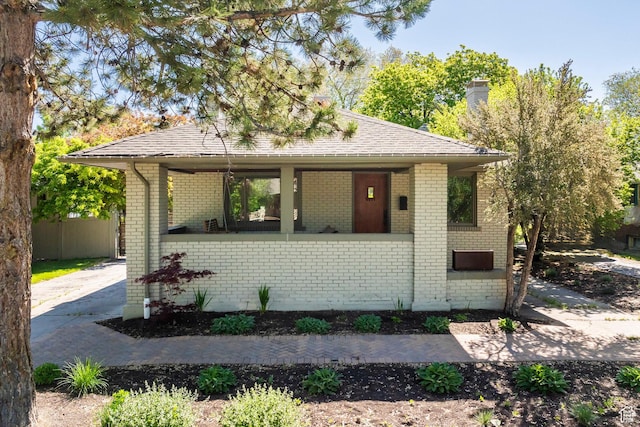 1991 S 800 E, Salt Lake City, UT 84105 - view of front of house featuring a shingled roof and brick siding