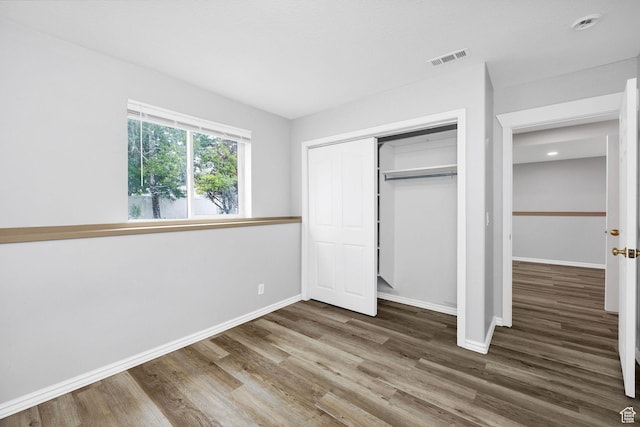736 Majestic Dr, Logan, UT 84321 - unfurnished bedroom with baseboards, wood finished floors, a closet, and recessed lighting