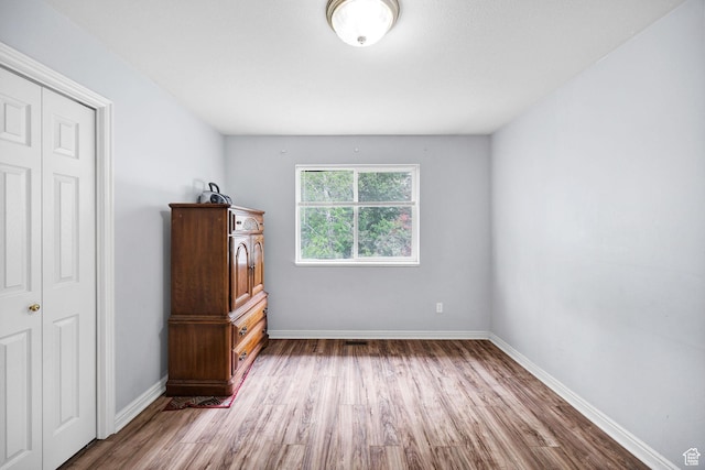 736 Majestic Dr, Logan, UT 84321 - unfurnished bedroom featuring wood finished floors and baseboards
