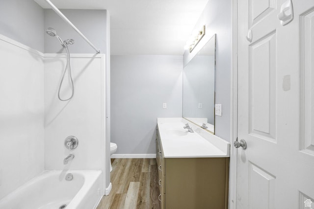 736 Majestic Dr, Logan, UT 84321 - full bathroom featuring toilet, vanity, wood finished floors, bathtub / shower combination, and baseboards