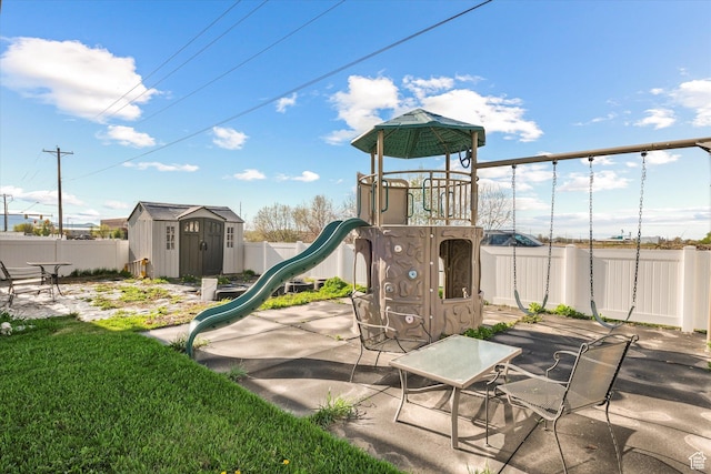 251 Sunstone Cir, Logan, UT 84321 - view of playground featuring an outdoor structure, a shed, and a fenced backyard