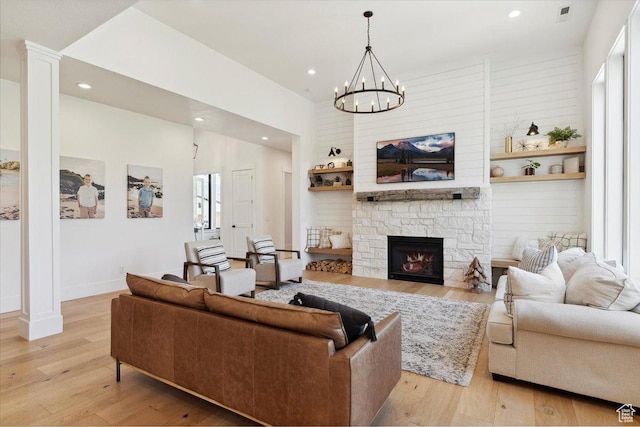 living room featuring recessed lighting, light wood-style flooring, visible vents, and plenty of natural light
