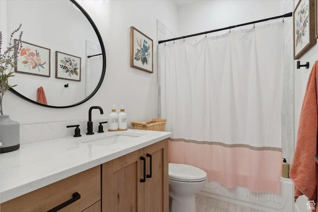 full bathroom with toilet, shower / tub combo with curtain, and vanity