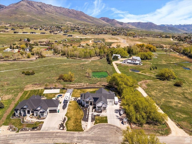 birds eye view of property featuring a mountain view
