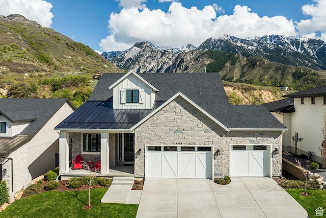 9293 S Regatta Ln, Cottonwood Heights, UT 84093 - craftsman inspired home with board and batten siding, a standing seam roof, covered porch, concrete driveway, and stone siding