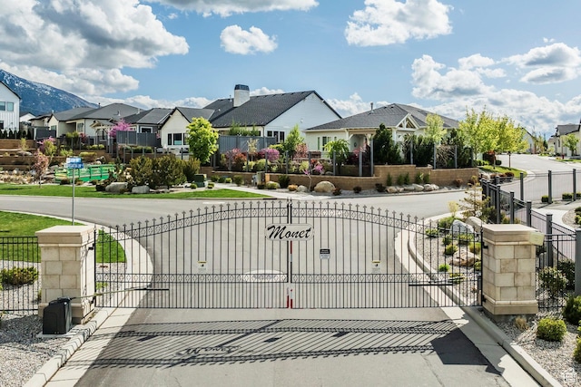 9293 S Regatta Ln, Cottonwood Heights, UT 84093 - view of gate featuring fence and a residential view