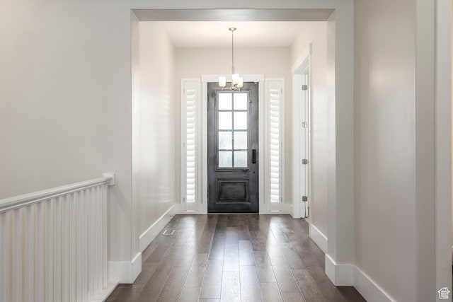 9293 S Regatta Ln, Cottonwood Heights, UT 84093 - foyer featuring dark wood finished floors, baseboards, and a notable chandelier