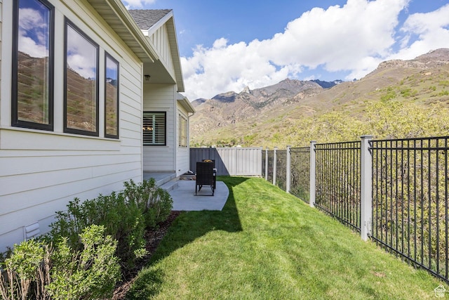 9293 S Regatta Ln, Cottonwood Heights, UT 84093 - view of yard featuring a mountain view, a patio area, and a fenced backyard