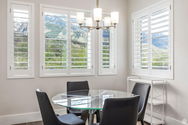 9293 S Regatta Ln, Cottonwood Heights, UT 84093 - dining room with baseboards, a wealth of natural light, and a notable chandelier