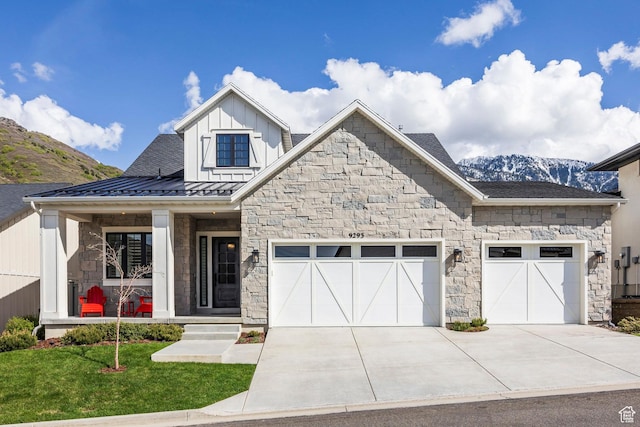 9293 S Regatta Ln, Cottonwood Heights, UT 84093 - view of front of property featuring covered porch, stone siding, a garage, board and batten siding, and a standing seam roof