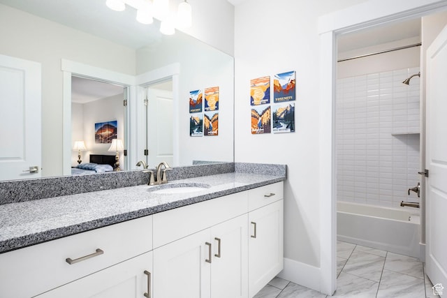 9293 S Regatta Ln, Cottonwood Heights, UT 84093 - bathroom featuring ensuite bathroom, marble finish floor, vanity, baseboards, and bathtub / shower combination