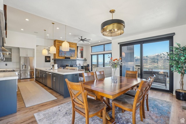 11332 N White Tail Ct Unit 30, Hideout, UT 84036 - dining room with a mountain view, light wood-style flooring, a ceiling fan, and recessed lighting