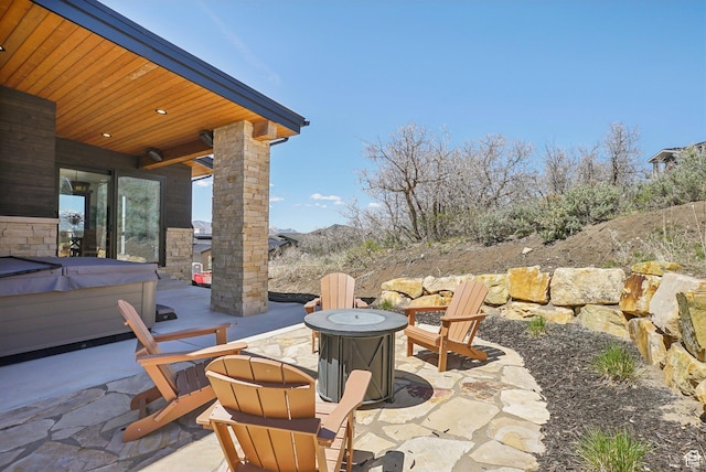 11332 N White Tail Ct Unit 30, Hideout, UT 84036 - view of patio / terrace featuring a fire pit and a hot tub