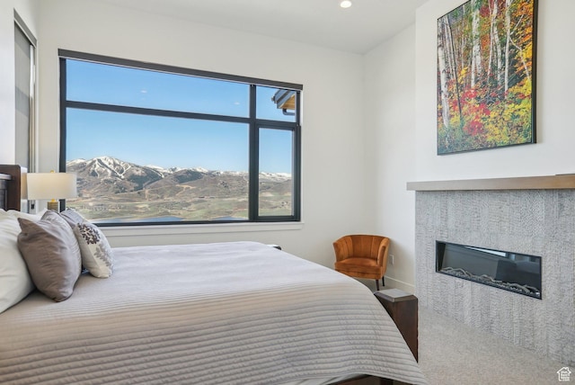 11332 N White Tail Ct Unit 30, Hideout, UT 84036 - bedroom featuring recessed lighting, a mountain view, and a glass covered fireplace