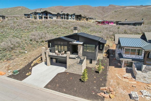 11332 N White Tail Ct Unit 30, Hideout, UT 84036 - view of front of property with concrete driveway, a mountain view, a carport, and stone siding