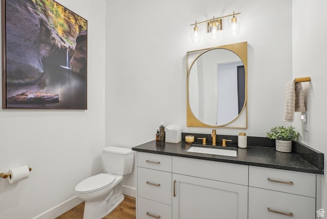 11332 N White Tail Ct Unit 30, Hideout, UT 84036 - half bath featuring toilet, baseboards, wood finished floors, and vanity