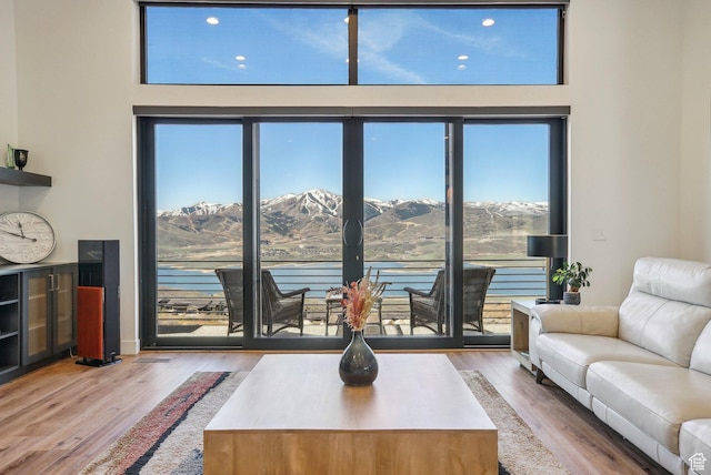 11332 N White Tail Ct Unit 30, Hideout, UT 84036 - living room featuring a water and mountain view, plenty of natural light, and wood finished floors