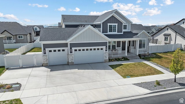 view of front of home featuring covered porch, a gate, a garage, board and batten siding, and roof with shingles