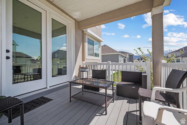 wooden terrace with a residential view