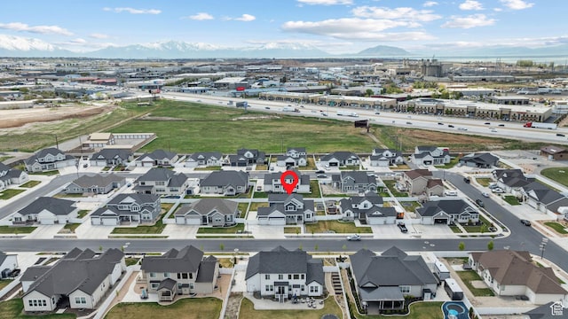 birds eye view of property featuring a mountain view
