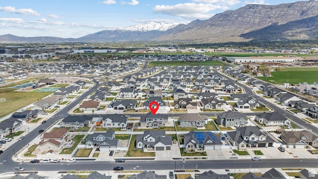 drone / aerial view featuring a residential view and a mountain view