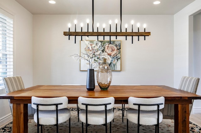 dining room featuring plenty of natural light, wood finished floors, recessed lighting, and baseboards
