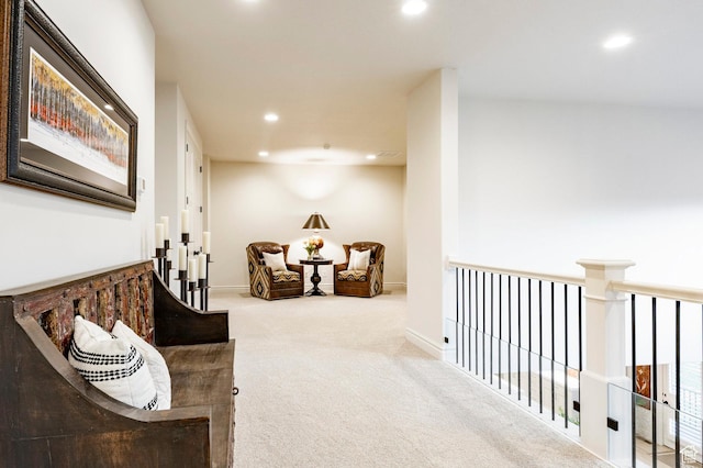 sitting room with recessed lighting, carpet flooring, and baseboards