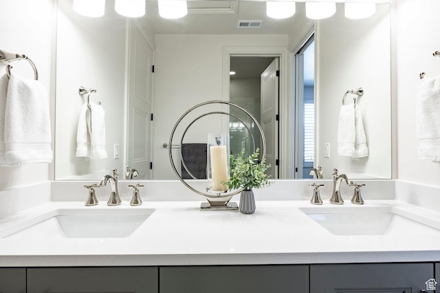 bathroom featuring plenty of natural light and vanity