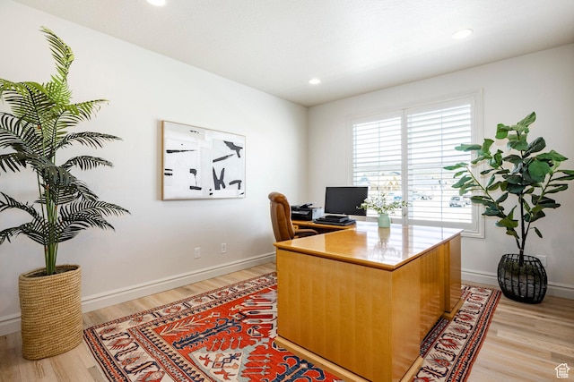 office space with light wood-style flooring, baseboards, and recessed lighting