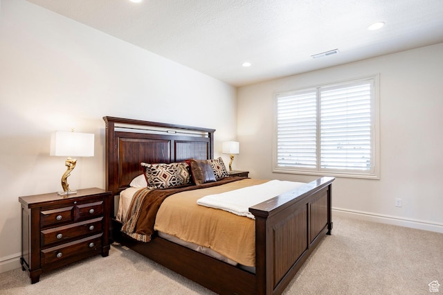 bedroom with light carpet, baseboards, and recessed lighting
