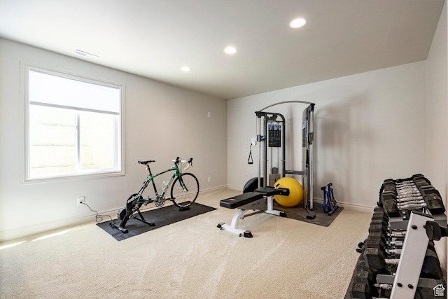 exercise room featuring carpet floors, recessed lighting, and baseboards