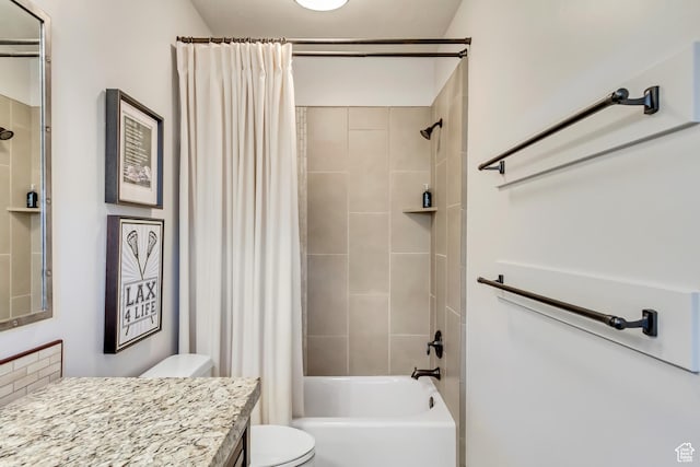 bathroom with shower / tub combo with curtain, vanity, and toilet
