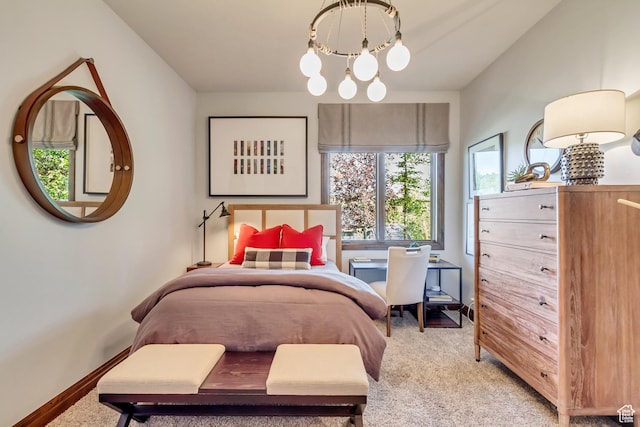 bedroom featuring baseboards, a notable chandelier, and light carpet