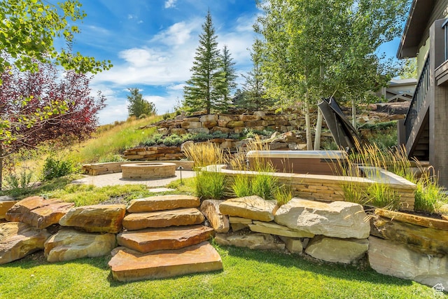 view of yard with an outdoor fire pit