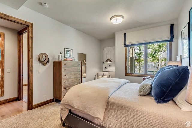bedroom featuring carpet floors and baseboards