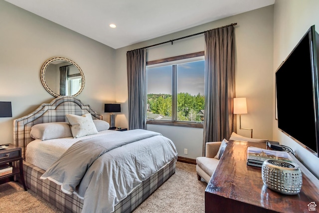 bedroom with baseboards, light carpet, and recessed lighting