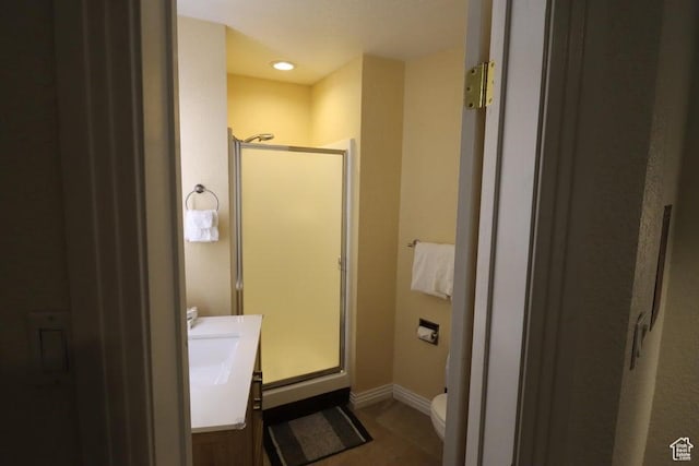 89 E Steam Engine Dr # 6B, Brian Head, UT 84719 - full bath featuring a stall shower, toilet, baseboards, tile patterned floors, and vanity