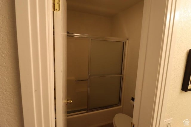 89 E Steam Engine Dr # 6B, Brian Head, UT 84719 - full bath with toilet, a textured wall, and bath / shower combo with glass door