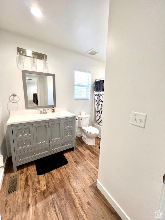 954 N 280 E, Elsinore, UT 84724 - bathroom with toilet, wood finished floors, vanity, visible vents, and baseboards