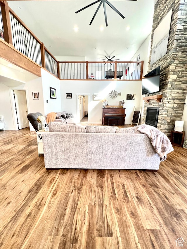 954 N 280 E, Elsinore, UT 84724 - living area featuring a high ceiling, wood finished floors, a fireplace, and ceiling fan