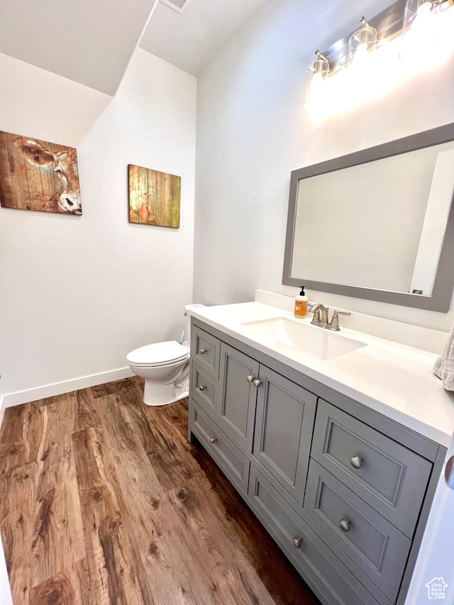954 N 280 E, Elsinore, UT 84724 - bathroom featuring toilet, baseboards, vanity, and wood finished floors