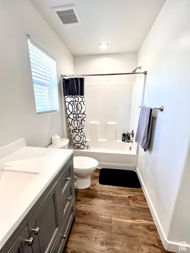 954 N 280 E, Elsinore, UT 84724 - bathroom featuring toilet, shower / tub combo with curtain, visible vents, vanity, and wood finished floors