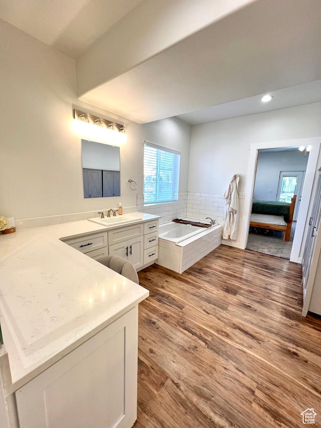 954 N 280 E, Elsinore, UT 84724 - ensuite bathroom featuring connected bathroom, a garden tub, a healthy amount of sunlight, and wood finished floors