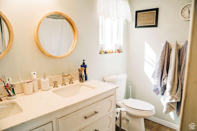 1478 S 4200 W, Cedar City, UT 84720 - bathroom featuring toilet, plenty of natural light, double vanity, and a sink