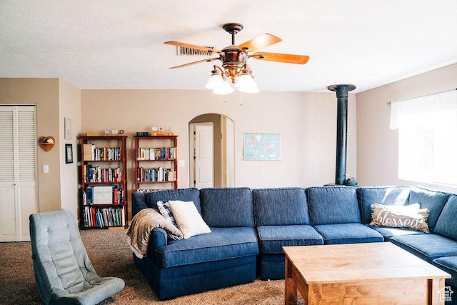 1478 S 4200 W, Cedar City, UT 84720 - living room featuring light colored carpet, visible vents, a ceiling fan, and arched walkways