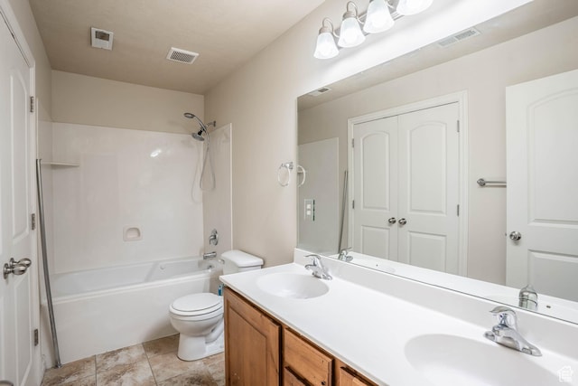 bathroom featuring toilet, visible vents, and a sink